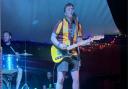 James Spencer performing at Glastonbury in his Bradford City shirt with former teacher-turned band member John Pullan playing drums
