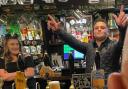Matthew Barker, of Barker Bridge Brewery, celebrates selling a pint of the first cask of beer he sold to a pub.