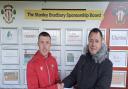 Adrian Benson (right) hands Joe Mitchell the man of the match award after Thackley's 2-0 win over Albion Sports last weekend.