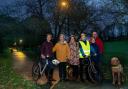 From left, with dogs: Katie Birks, Elaine Hiser, Fiona Protheroe, Will Hiser-Dobson, Isla Hiser Dobson and Richard Dobson in Skipton’s Aireville Park, where new lighting has been introduced.