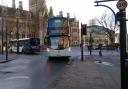 A generic photo shows a bus in Bradford city centre