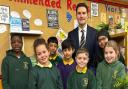 Headteacher Andrew Knight and pupils at St John’s CE Primary School celebrate their Outstanding Ofsted