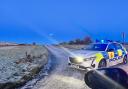 Police at scene of crash on icy road amid weather warning