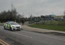 A police car parked outside Buttershaw Business & Enterprise College, in Reevy Road West.