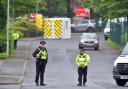 Police stand guard at the entrance to the Acorn Park Industrial Estate in Shipley where a protest took place on Wednesday
