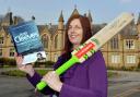 Joanne Christie of the University School Of Management is pictured with a few items for the auction