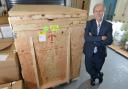 Professor Laurence Patterson with the crate in which the newly-acquired machine was delivered to the University of Bradford's Institute for Cancer Therapeutics