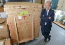 Professor Laurence Patterson with the new proteomics mass spectrometer machine as it arrived at the University of Bradford