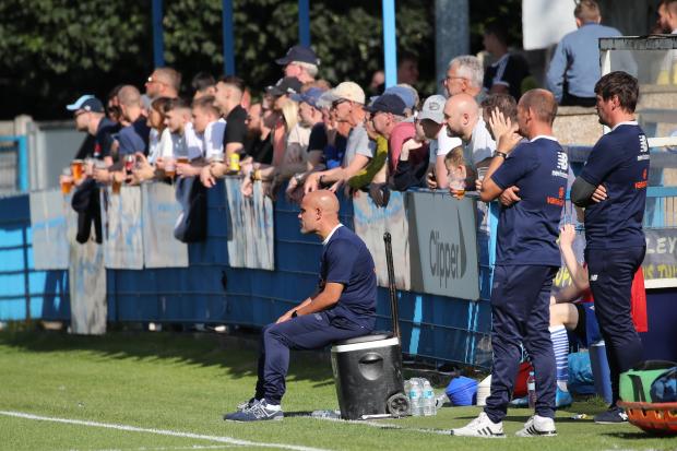 Marcus Bignot (sat down) watches on as his Guiseley side beat Gloucester City 2-1 for their first National League North win of the season. Picture: Alex Daniel.