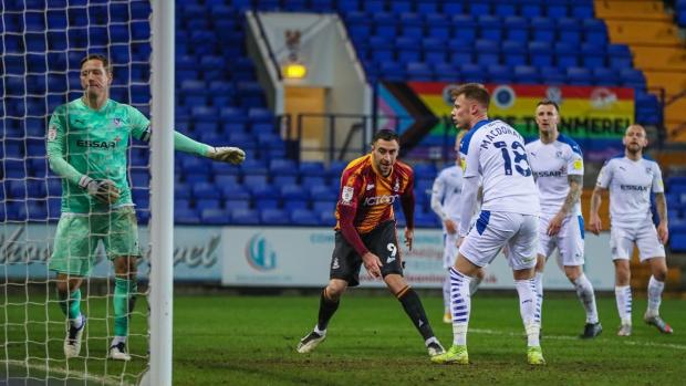 Bradford Telegraph and Argus: Lee Novak scoring for City against Tranmere. Picture: Thomas Gadd.