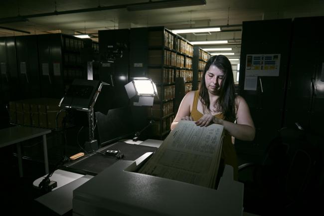 Findmypast technician Laura Gowing scans individual pages of the 30,000 volumes of the 1921 Census at the Office for National Statistics (ONS) near Southampton.