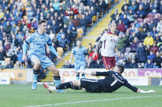 Jake Young scores Forest Green's equaliser against City at Valley Parade in October