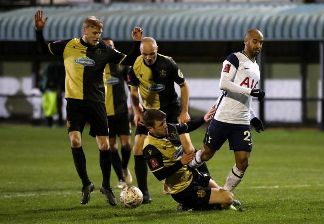 Tottenham Hotspur's Lucas Moura (right) is tackled by Marine's James Joyce during the Emirates FA Cup third round match at Rossett Park, last season.  Pic: Martin Rickett