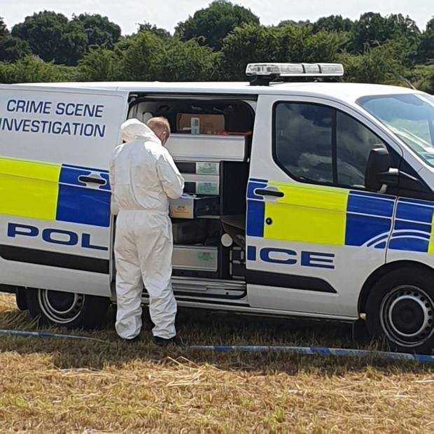 Bradford Telegraph and Argus: Police at the crime scene near Wigginton last July