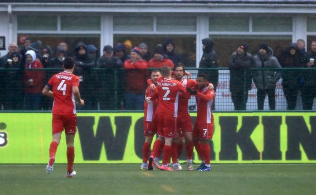 Morecambe's Cole Stockton (second right) celebrates scoring their side's first goal of the game the Emirates FA Cup second round match at the Tarmac Silverlands Stadium, Buxton. Picture date: Saturday December 4, 2021.