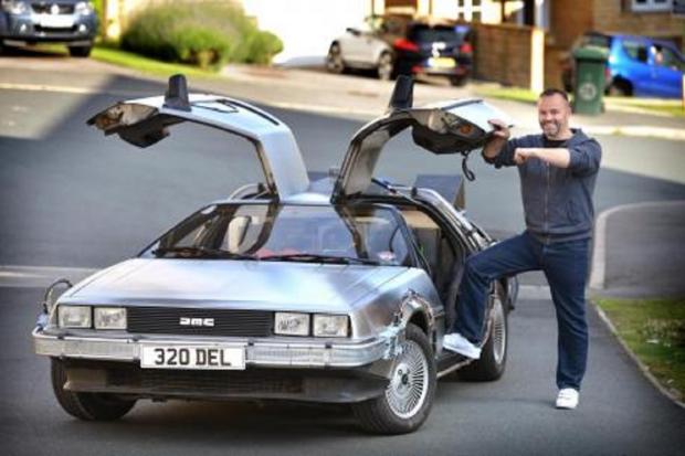 Bradford Telegraph and Argus: Mike Hutchinson pictured with the Delorean he built in 2015