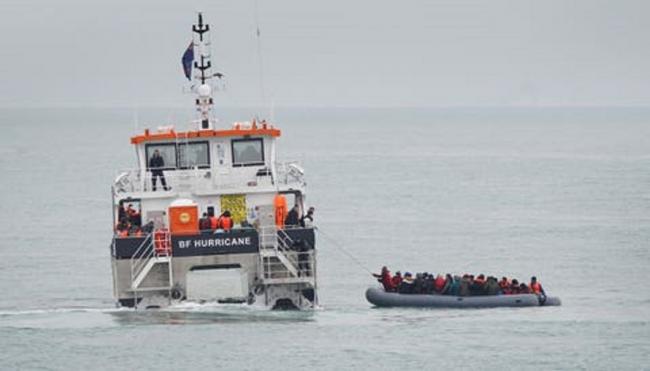 A group of migrants being rescued by Border Force vessel off Kent coast