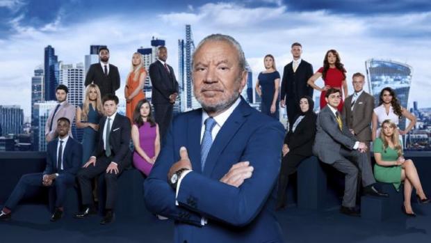 Bradford Telegraph and Argus: Lord Sugar, front, and the 2022 candidates of The Apprentice, including Bradford's Shama Amin 