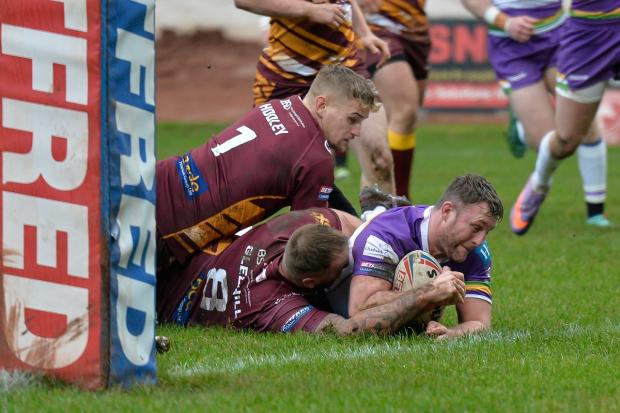 New signing Sam Scott bustles his way over for the first Bulls try of 2022. Pictures: Tom Pearson