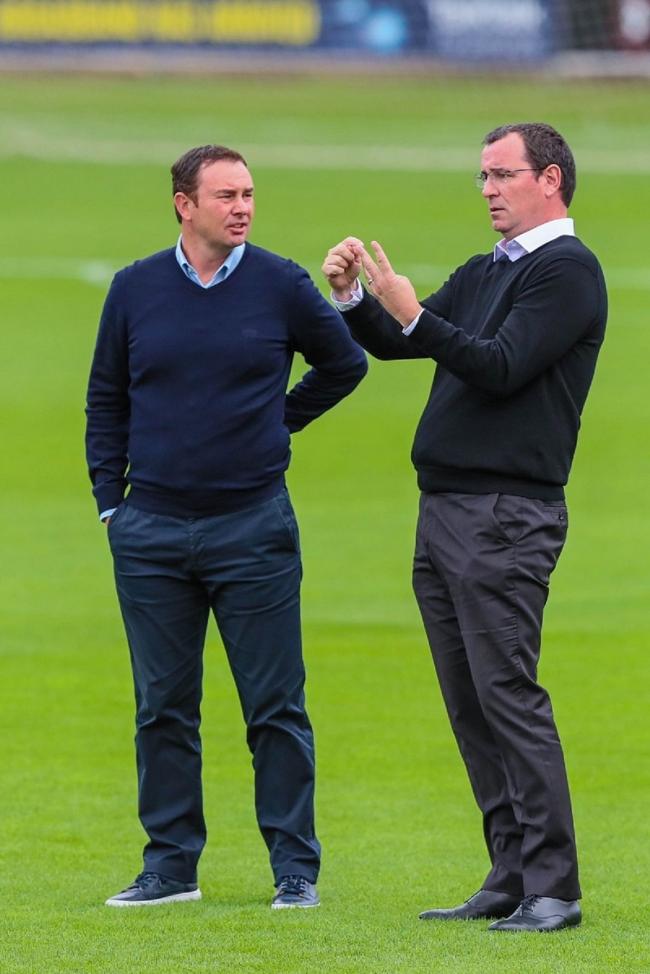Derek Adams, left, and Gary Bowyer chatting before the game at Salford