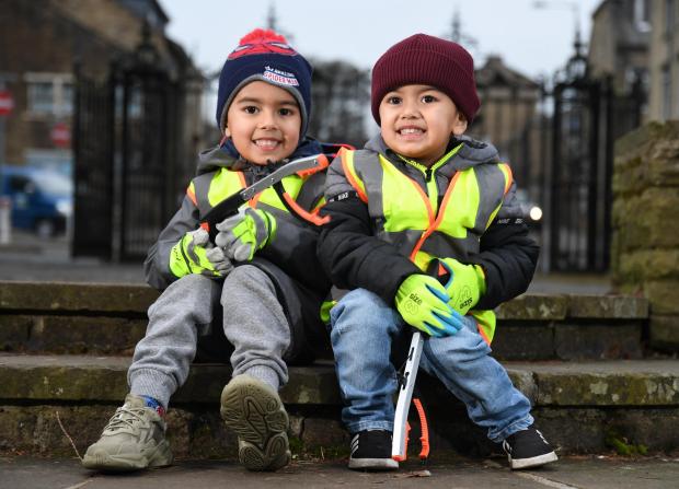 Bradford Telegraph and Argus: Kaidan Khan, aged four (left) and his brother, Mikaeel, two, are set to carry out weekly litter picks around Bradford district parks and streets 