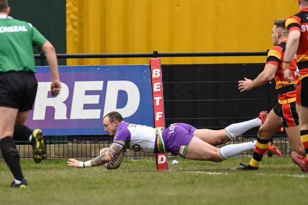 Matty Dawson-Jones dives at full stretch to score his second try in the first half. Pictures: Tom Pearson
