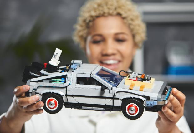 Bradford Telegraph and Argus: A woman holding the LEGO Back to The Future Delorean set. Credit: LEGO