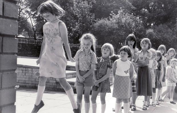 Bradford Telegraph and Argus: Children playing street games in 1977. Remember chalking Hopscotch onto paving flags?
