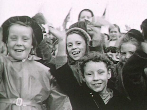 Bradford Telegraph and Argus: Youngsters waiting to see the Queen in 1954