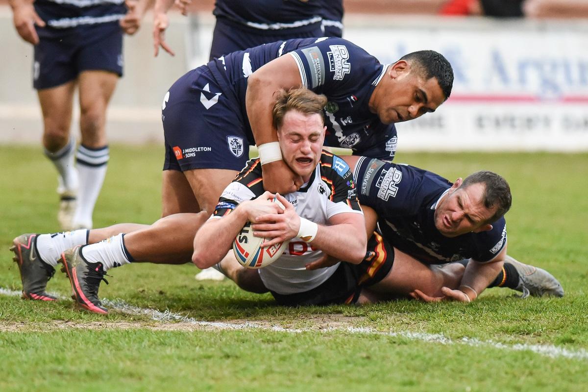 Elliot Hall plunges in for the Bulls' opening try. Picture: Tom Pearson