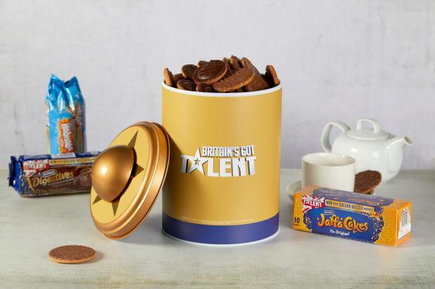 Bradford Telegraph and Argus: The McVitie’s Britain’s Got Talent Biscuit Tins feature a working golden buzzer. Picture: Taylor Herring