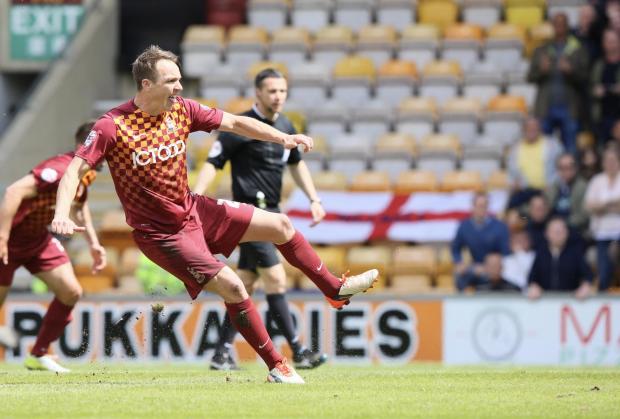 Bradford Telegraph and Argus: Tony McMahon strikes home City's penalty. Picture: Tom Gadd.