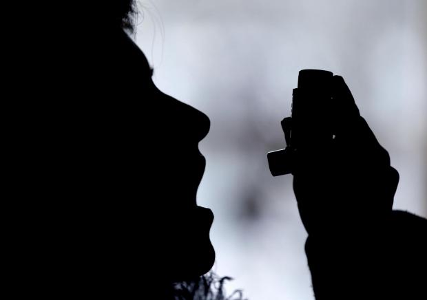 Bradford Telegraph and Argus: Silhouette of a person using an inhaler. Credit: Canva