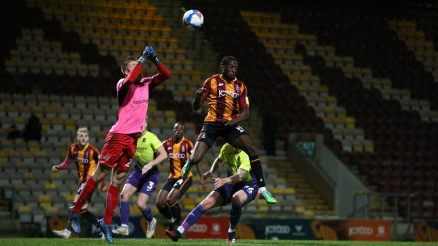 Bradford Telegraph and Argus: Clayton Donaldson goes for a header as City face Exeter. Picture: Thomas Gadd.