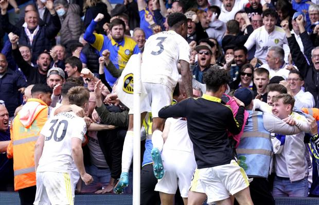 Bradford Telegraph and Argus: Leeds United players and fans go wild after their late equaliser against Brighton at Elland Road
