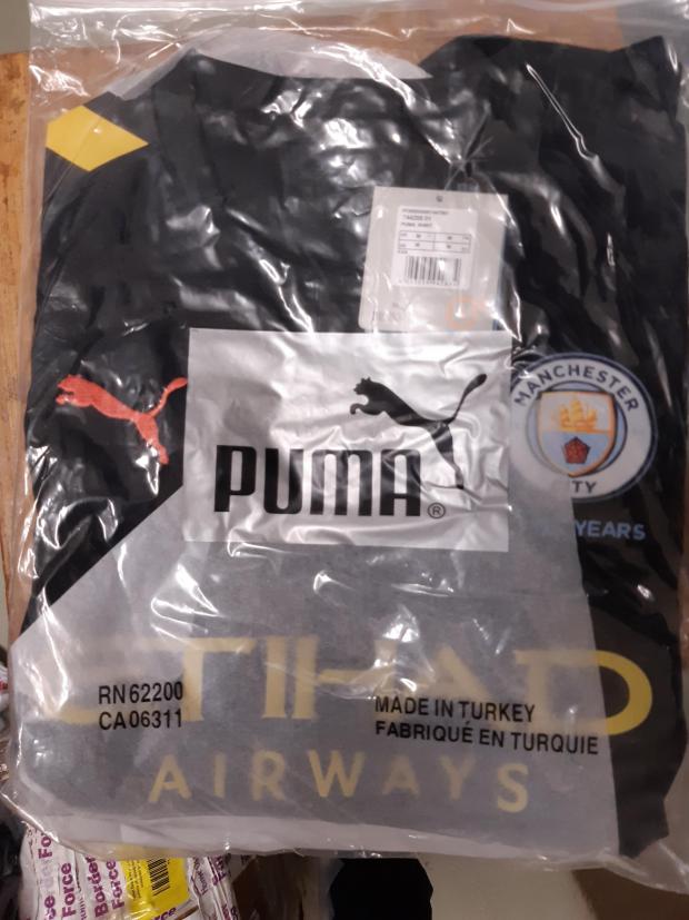 Bradford Telegraph and Argus: A fake Man City shirt that Sajid Hussain was selling. Picture: West Yorkshire Trading Standards