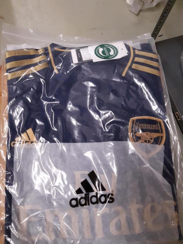 Bradford Telegraph and Argus: A fake Arsenal shirt that Sajid Hussain was selling. Picture: West Yorkshire Trading Standards