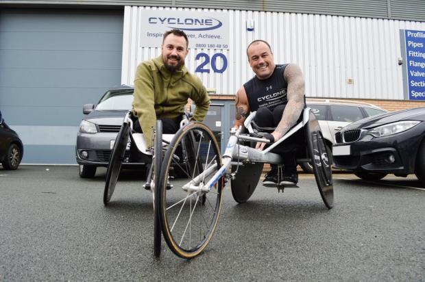 Bradford Telegraph and Argus: Martin Hibbert, who was left paralysed after the Manchester terror attack, is pictured with former former paralympian Richie Powell. Picture: Martin Hibbert