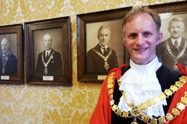 Cllr Judge, and the photograph of his ancestor, William Judge, immediately left.