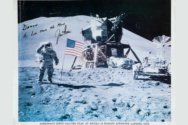 Bradford Telegraph and Argus: One of the most iconic images of a man walking on the Moon. Irwin signed this photo for Butler when he spoke at Bradford Cathedral. Photo via Bradford Cathedral/Damon Butler.