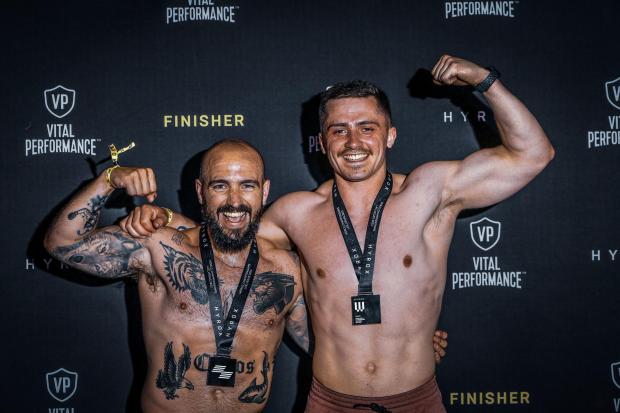 Chris, left, and Harry flexing after the finish