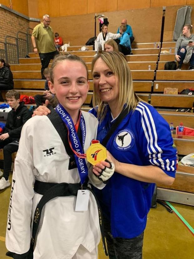 Bradford Telegraph and Argus: Gina Bene-Hamill beaming after her gold medal, alongside Natalie Simpson-Kidd, in Manchester.  Picture: Horizon Taekwondo Academy.