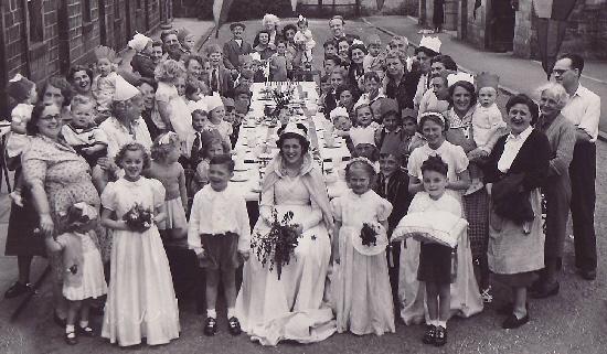 Bradford Telegraph and Argus: All smiles for a Coronation street party in Peel Place, Burley-in-Wharfedale, in 1953 