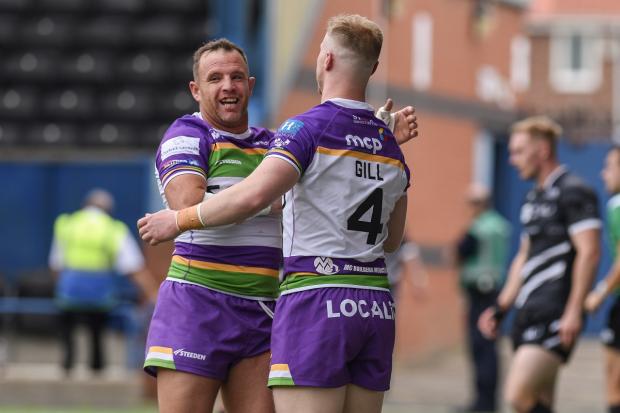 Bradford Telegraph and Argus: George Flanagan congratulates Kieran Gill for his try in the 31-6 win at Widnes 