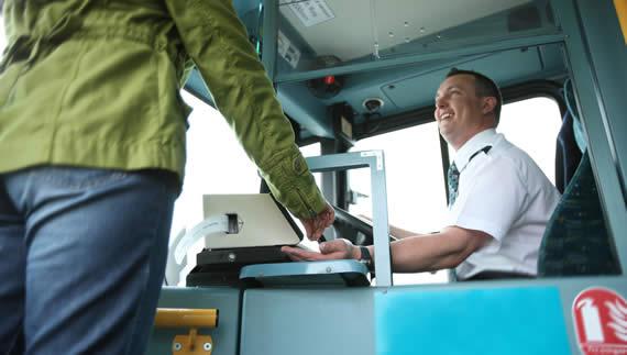 Bradford Telegraph and Argus: Photo of an Arriva bus driver helping a customer buy a ticket. 