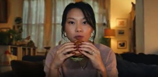 Bradford Telegraph and Argus: A shot from the now banned Tesco advert of a woman eating a burger (Tesco/PA)