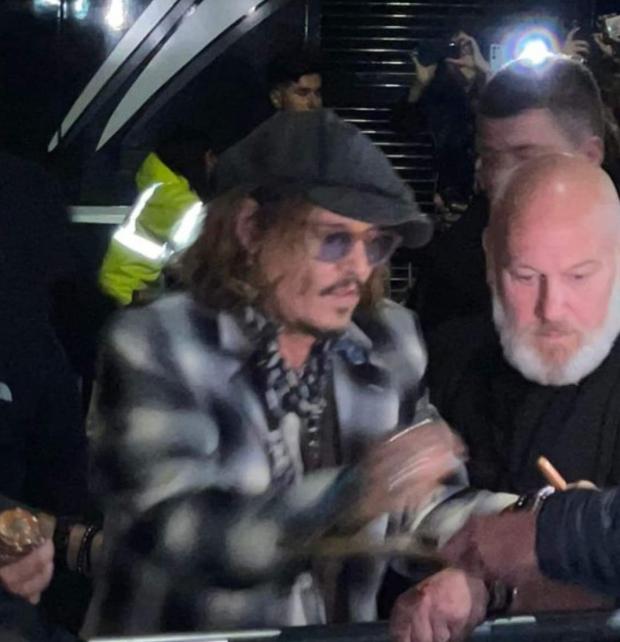 Bradford Telegraph and Argus: Johnny Depp signed autographs outside York Barbican in York Picture: Katie Masiak