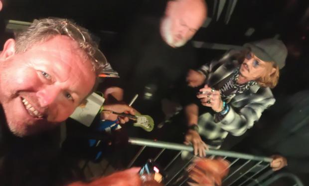 Bradford Telegraph and Argus: The long wait was worth it for fan Nick Hale, waited until almost midnight to see the rockers come out of the venue, as Johnny Depp signed his guitar for him. Picture: Nick Hale
