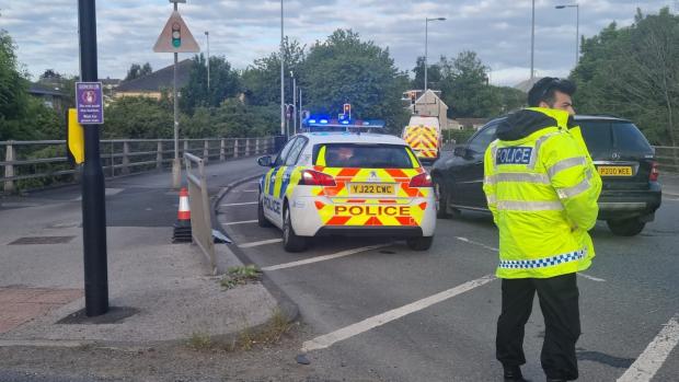 Bradford Telegraph and Argus: Police at the top of the M606 following the crash