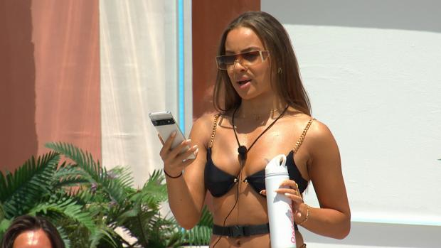 Bradford Telegraph and Argus: Danica gets a text as Love Island continues tonight at 9pm on ITV2 and ITV Hub. Episodes are available the following morning on BritBox. Credit: ITV